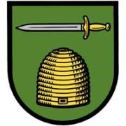 Wappen der Gemeinde - Bienkorb im grünen Hintergrund